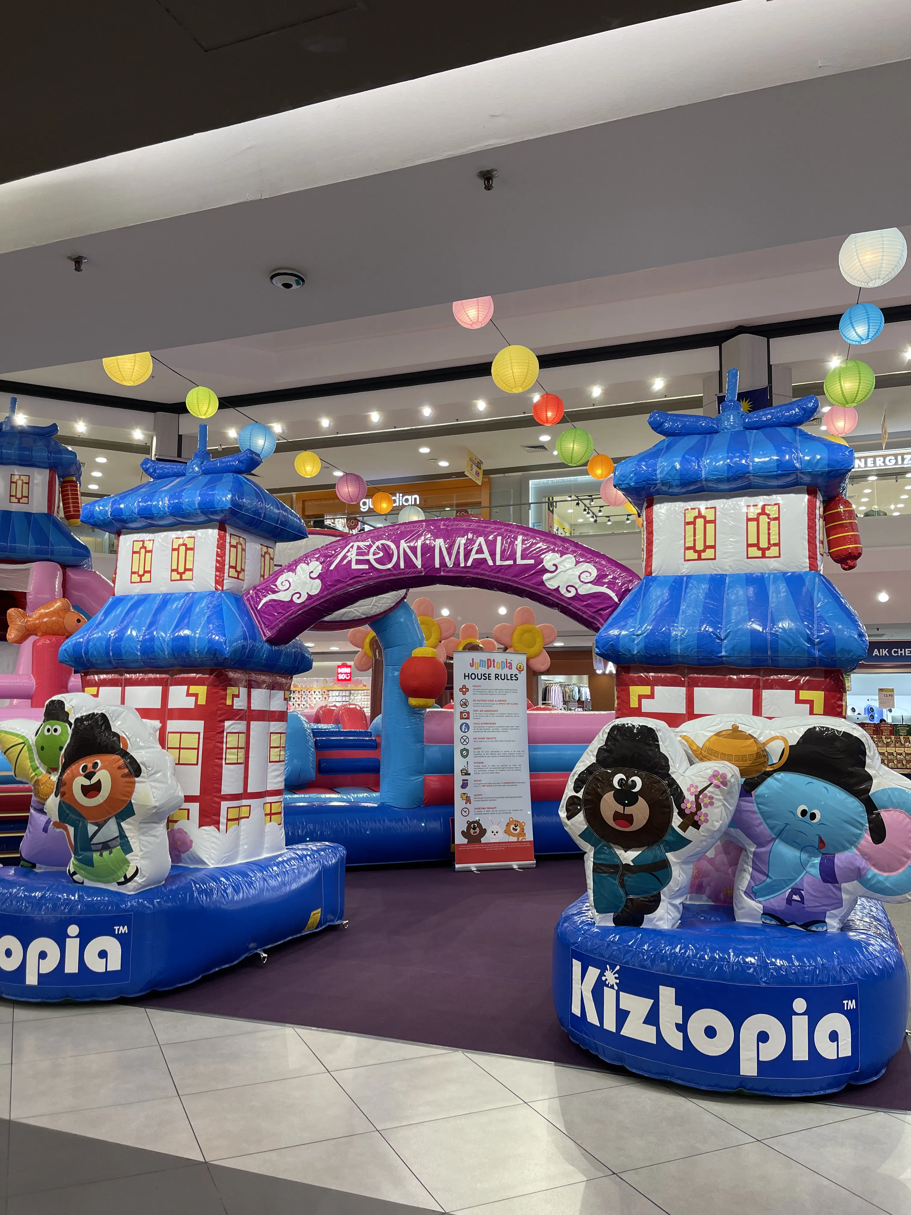 Family enjoying Jumptopia attractions